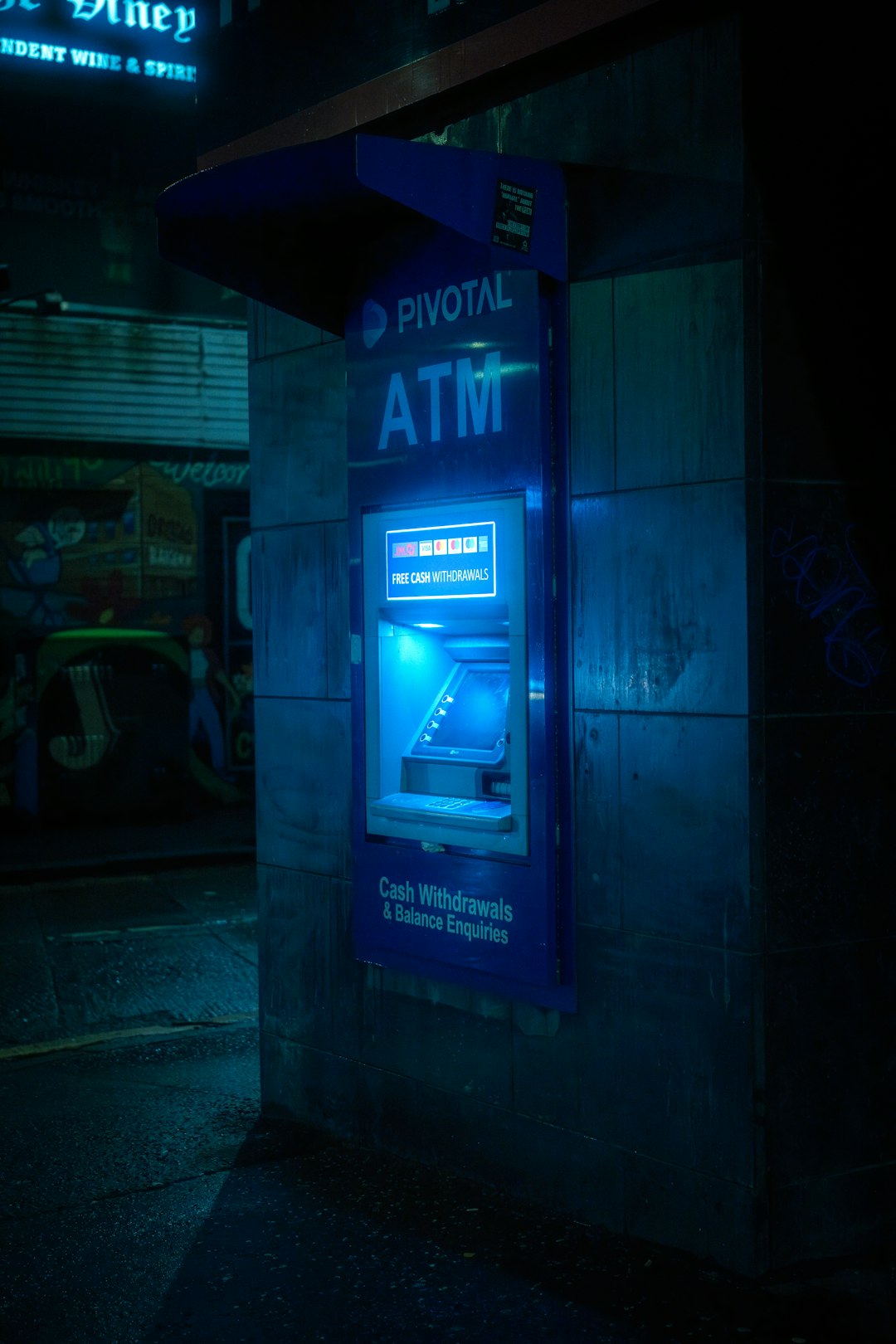 blue-atm-machine-glows-brightly-at-night-5pjo-9ldf4o